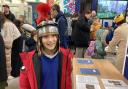 History fan - A St Peter's Primary School pupil wearing a Roman helmet at the exhibition