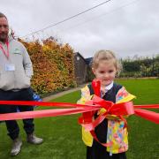 GRAND OPENING: Little Lottie cutting the ribbon for the new EYFS area