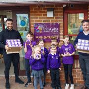 Kind - left to right: Ashley Perkins, Marketing Manager Milbank Group, Mr Woodcock, Deputy Head, with children from  Earls Colne Primary School & Nursery