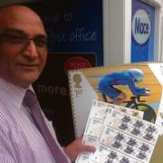 Postmaster Jake Singh with the limited edition Olympic stamps