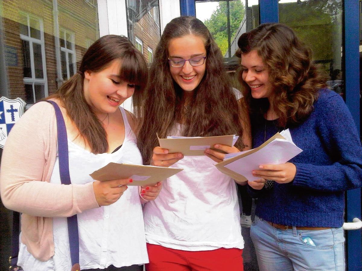 Hedingham School pupils Ellie Jolley, Elizabeth Ramsey and Penny Mills compare their grades