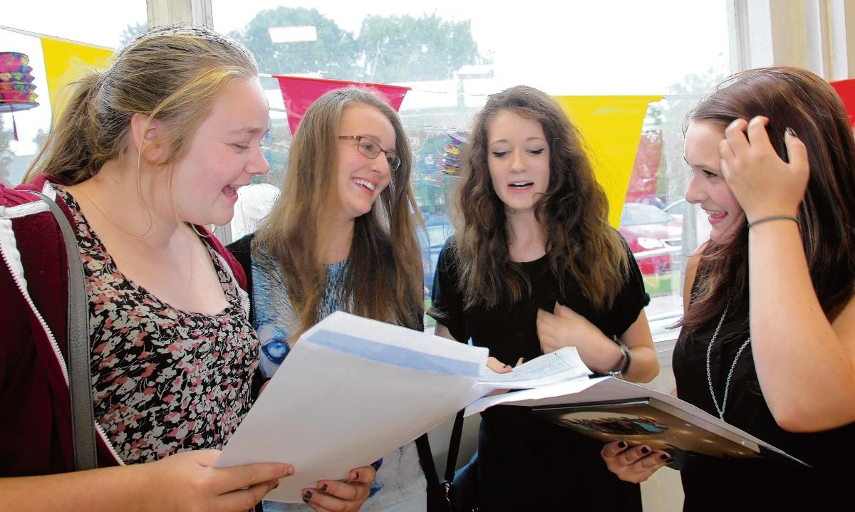 Charlotte Mayes, Megan Peakall, Lauren Cleary and Kerry Gooden check their results at Ramsey College in Halstead