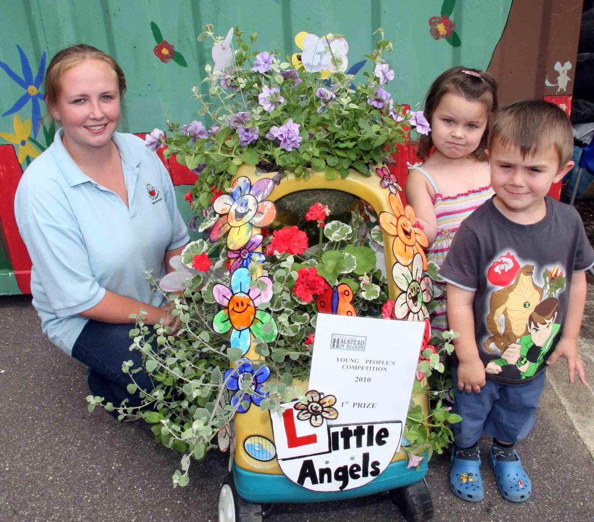 JUDGING: Winners of the childrens section of the Halstead in Bloom Little Angels Pre School. l-r, Daniella Kenny pictured with Eddy Parkinson, 4, and Poppy Quinn, 3 in 2010