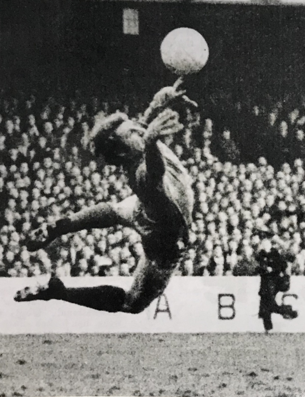 Heroic display - U’s goalkeeper Graham Smith, an Evertonian, flies through the air as he pulls off one of his many outstanding saves