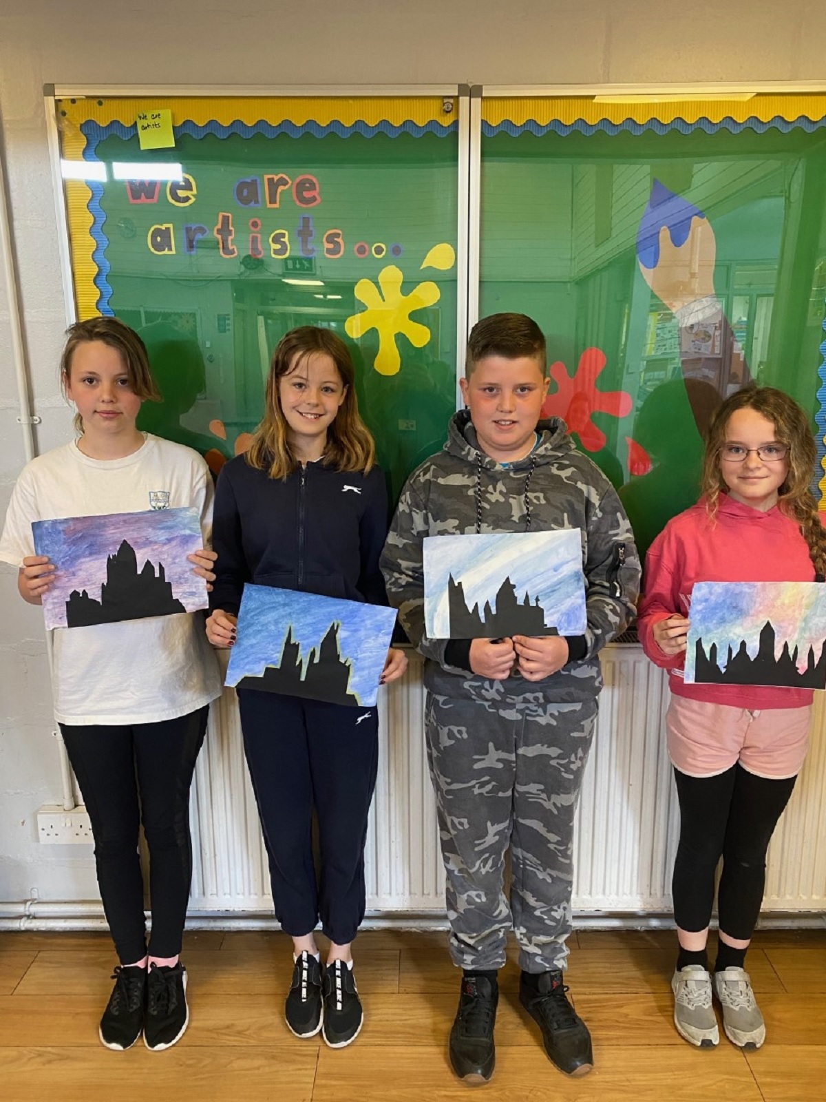 Aspiring artists - these Year 6 pupils used water-colour paint to create silhouettes of the Hogwarts School of Witchcraft and Wizardry. Pictured are Sophea Stephens, Lucy Readings, Jamie Patnell and Kirsty Warren