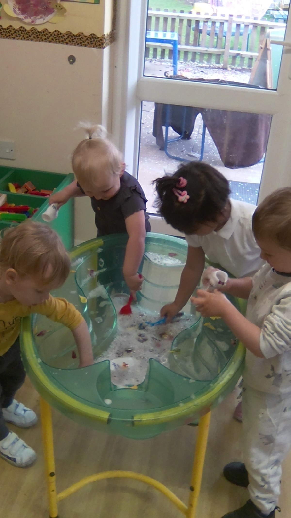 Double, double toil and trouble - Nursery children created magical potions in the water tray. Pictured are Eliza Nicholas, Aalimah Ali, Leyton, Charlie Collingwood