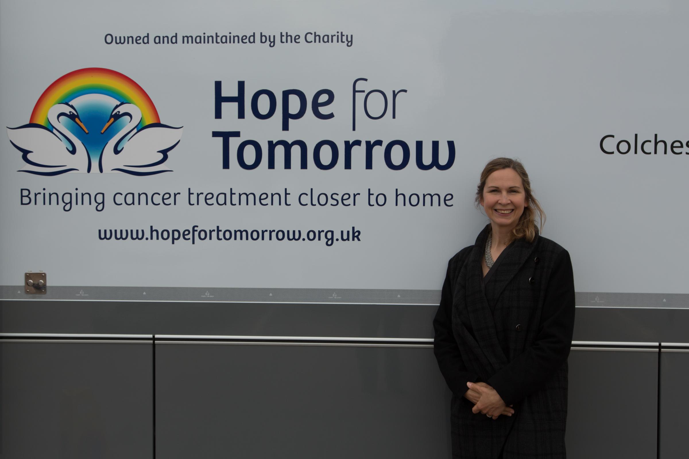 Brave feat: Catherine Gaskell, who is wing walking for Hope for Tomorrow, outside the mobile cancer care unit in Stanway Picture: Rob Gaskell