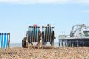 Brighton UK 17th May 2020 - Brighton beach and seafront are pretty quiet at lunchtime on a warm day with a mixture of sunshine and clouds on the first weekend after the governments slight easing of lockdown restrictions in England during the coronavirus C