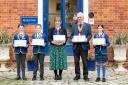 Headteacher Carolyn Moss and rotary club president David Ainge, with heads of school Lexi, Freddie and Madeleine (Picture: Tony Sale)
