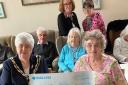 CHARITABLE DONATION: Jackie Pell presents the cheque to the Halstead Day Centre