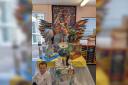 CREATIVE MINDS: Pupils pictured with one of the sculptures