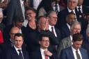 Sir Jim Ratcliffe holds his head in his hands in front of Sir Keir Starmer in the Old Trafford directors’ box (Martin Rickett/PA)
