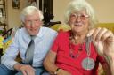 June Guild – with husband        John and her commemorative medal. Inset: A close-up