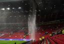 A general view of the roof of the stadium leaking following the match (Martin Rickett/PA)