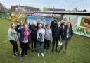Students from the Ramsey Academy in Halstead in front of the mural