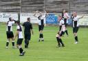 Arms aloft: Halstead Town's players protest a decision during their FA Cup defeat to Romford.