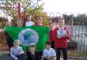 Proud - Youngsters at de Vere Primary with their Green Flag (Image: de Vere Primary School)
