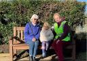 Chappel & Wakes Colne station adopter, Kath Beck (right), with some visitors to the station on the talking bench