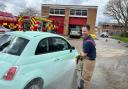 Raising funds - firefighter Steven Hill cleaning a car