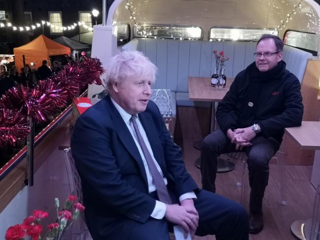Boris Johnson with Scott Goodfellow, joint MD at Wilkin and Sons, at the food and drink festive market at Number 10 Downing Street. Photo: Chloe McGrath