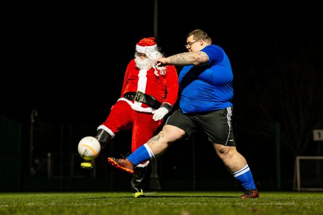 Festive football: Santa joined in with the programme for a kickabout