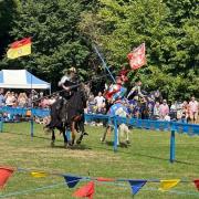 Knights visiting the castle grounds last year for a special joust event
