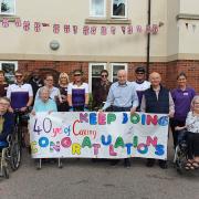 Celebration - Staff and residents at Colne View care home made a banner to welcome the Care UK cycling team (Care UK)