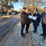 Del Thomas and fellow residents hand the petition to Chris Siddall