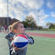 A youngster enjoying a basketball session