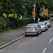 Traffic often builds up around cars parked outside Halstead Public Gardens in Trinity Street