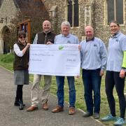 Fundraising - members of the Earls Colne Bellringers pictured outside St Andrew's Church receiving a cheque for £500 for the Bellfund on April 26 from Blackwell Earthmoving Limited