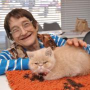 Kathy Knopp with 'grumpy' Alfie at Halstead's new Meow Cat Cafeat