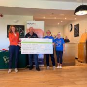 Cheque - Colne Valley Golf Club ladies captain Ruth Eyre-Pugh and men's captain Steve Leak handed the cheque to Cathy Chambers and Ann from the MNDA