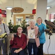 Fun - resident Jack Sargant with Casper, resident Peter Kluss, resident Eileen Patten, lifestyle lead Dawn Burford with Mabel