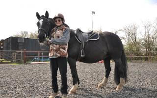 HORSING AROUND: Kathy had a wonderful day meeting the horses,  helping to feed them and riding 22-year-old horse Hannah