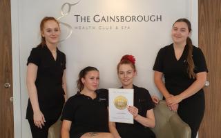 ALL SMILES: Staff at the Gainsborough with their award