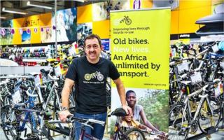Sporting hero - Chris Boardman MBE at a bicycle drop-off point for Re-Cycle